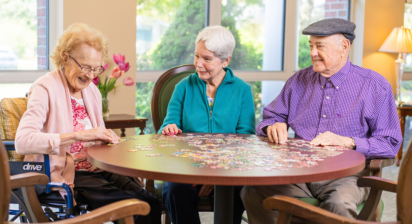 resident friends doing a puzzle together